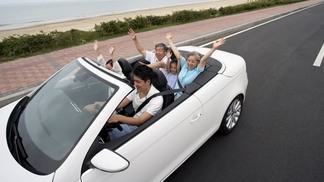 Happy Family Driving in a Convertible